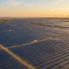 Aerial view of a large solar and wind power plant in India, representing India's non-fossil power capacity crossing 300 GW